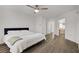 This primary bedroom is bright, with an en-suite bathroom, wood floors and a ceiling fan at 270 Snowy River Cir, Henderson, NV 89074