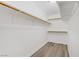 Walk-in closet with built-in shelving and wooden closet rods for optimal organization at 270 Snowy River Cir, Henderson, NV 89074