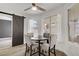Bright dining area with sliding barn door, view of pool, and neutral decor at 270 Snowy River Cir, Henderson, NV 89074