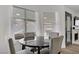 Cozy dining area with a marble table and view of the backyard and outdoor area at 270 Snowy River Cir, Henderson, NV 89074