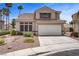 Charming two-story home with a well-maintained front yard and two-car garage at 270 Snowy River Cir, Henderson, NV 89074