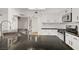 Modern kitchen features stainless steel appliances, white cabinets, and black granite countertops at 270 Snowy River Cir, Henderson, NV 89074