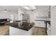 Bright open kitchen featuring granite countertop island, stainless steel appliances, and hardwood floors at 270 Snowy River Cir, Henderson, NV 89074
