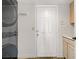 Functional laundry room featuring modern washer and dryer with storage and outside access at 270 Snowy River Cir, Henderson, NV 89074