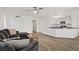 Bright living room featuring open layout, hardwood floors, and kitchen access at 270 Snowy River Cir, Henderson, NV 89074