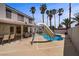 Sparkling in-ground pool features a built-in slide and palm trees for added privacy at 270 Snowy River Cir, Henderson, NV 89074