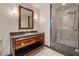 Well-lit bathroom with dark wood vanity, granite counters, and a large glass walk-in shower at 2700 Las Vegas Blvd # 610, Las Vegas, NV 89109