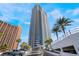 Modern high-rise with city views, a valet entrance, and lush landscaping at 2700 Las Vegas Blvd # 610, Las Vegas, NV 89109