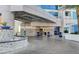 Elegant exterior of a luxury high-rise with valet parking and water feature at the entrance at 2700 Las Vegas Blvd # 610, Las Vegas, NV 89109