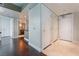 Hallway with hardwood floors, multiple closets, and views into the bathroom and main living area at 2700 Las Vegas Blvd # 610, Las Vegas, NV 89109