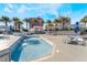 Community hot tub with lounge chairs and palm trees surrounding it at 2700 Las Vegas Blvd # 610, Las Vegas, NV 89109