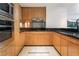 Modern kitchen features stainless steel appliances, sleek wooden cabinetry and marble countertops at 2700 Las Vegas Blvd # 610, Las Vegas, NV 89109