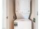 Stacked white washer and dryer located inside the property at 2700 Las Vegas Blvd # 610, Las Vegas, NV 89109