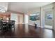 Open-concept living and dining room features hardwood floors, bar seating and a city view at 2700 Las Vegas Blvd # 610, Las Vegas, NV 89109
