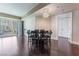 Bright living room with dark hardwood floors, chandelier, and views of the Las Vegas skyline at 2700 Las Vegas Blvd # 610, Las Vegas, NV 89109