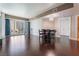 Spacious living room with hardwood floors, modern light fixture, and a large window with city views at 2700 Las Vegas Blvd # 610, Las Vegas, NV 89109
