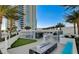 Relaxing pool area featuring a mini golf area, outdoor seating and fire feature at a luxury high-rise with palm trees at 2700 Las Vegas Blvd # 610, Las Vegas, NV 89109