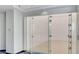 An indoor squash court with glass doors and white paneled walls, perfect for recreational activities at 2700 Las Vegas Blvd # 610, Las Vegas, NV 89109