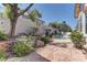 Landscaped backyard featuring pool with stone accents at 2725 Cool Lilac Ave, Henderson, NV 89052