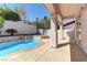 Backyard pool and spa surrounded by lush landscaping and patio at 2725 Cool Lilac Ave, Henderson, NV 89052