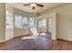 Bright bedroom features wood floors, large windows, and mirrored closet doors at 2725 Cool Lilac Ave, Henderson, NV 89052