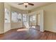 Bedroom featuring wood floors, mirrored closet doors and natural light from bright windows at 2725 Cool Lilac Ave, Henderson, NV 89052
