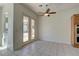 Dining area with tiled floors, a ceiling fan, and views of the pool at 2725 Cool Lilac Ave, Henderson, NV 89052