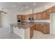 Spacious kitchen features wooden cabinets, granite countertops, stainless steel appliances, and a large island at 2725 Cool Lilac Ave, Henderson, NV 89052