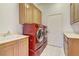 Laundry room featuring washer and dryer, storage and sink area at 2725 Cool Lilac Ave, Henderson, NV 89052