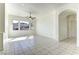 Bright living room features tile floors, contemporary lighting and an arched doorway at 2725 Cool Lilac Ave, Henderson, NV 89052