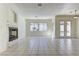 The living room features a tiled fireplace, large windows, and ample space at 2725 Cool Lilac Ave, Henderson, NV 89052