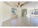 Bright living room featuring tile flooring, large windows, and ample natural light at 2725 Cool Lilac Ave, Henderson, NV 89052