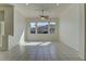 Bright and airy living room featuring tile flooring, recessed lighting, ceiling fan, and ample natural light at 2725 Cool Lilac Ave, Henderson, NV 89052