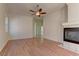 Bright living room with wood floors, fireplace, and views to the next room at 2725 Cool Lilac Ave, Henderson, NV 89052