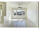 Bright and airy living room, features tile floors, contemporary lighting and a ceiling fan at 2725 Cool Lilac Ave, Henderson, NV 89052
