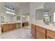 Main bathroom featuring double sinks, large mirrors, and ample counter space at 2725 Cool Lilac Ave, Henderson, NV 89052