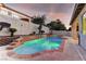 Inviting backyard pool with stone accents and lush landscaping perfect for relaxation and entertaining at 2725 Cool Lilac Ave, Henderson, NV 89052