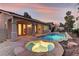 Serene backyard oasis featuring a pool, spa, and a covered patio perfect for relaxing outdoors at 2725 Cool Lilac Ave, Henderson, NV 89052
