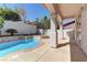 Backyard pool featuring waterfall and patio cover at 2725 Cool Lilac Ave, Henderson, NV 89052