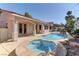 Backyard view of pool and spa area with exterior elevation of the house at 2725 Cool Lilac Ave, Henderson, NV 89052