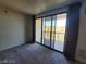 Inviting living area with sliding glass doors that lead to a large balcony and scenic views at 29 Montelago Blvd # 336, Henderson, NV 89011
