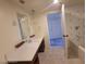 Bright bathroom featuring a double sink vanity with modern fixtures and a large mirror at 29 Montelago Blvd # 336, Henderson, NV 89011