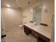 Bright bathroom with a large vanity, tile flooring, and a separate toilet at 29 Montelago Blvd # 336, Henderson, NV 89011