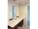 Bathroom featuring a single sink vanity with modern fixtures and a large mirror at 29 Montelago Blvd # 336, Henderson, NV 89011