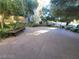Nice courtyard with landscaping and shady trees and a dark bench at 29 Montelago Blvd # 336, Henderson, NV 89011