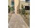 Condo building entrance with a walking path and small trees at 29 Montelago Blvd # 336, Henderson, NV 89011