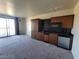 Efficient kitchenette boasts modern cabinets, a microwave, compact refrigerator, and practical black countertops at 29 Montelago Blvd # 336, Henderson, NV 89011