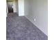 Neutral living area with a view to an entry door, offering a blank canvas to customize at 29 Montelago Blvd # 336, Henderson, NV 89011