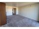 Open living area with neutral carpet and wall colors, promoting a bright and airy feel at 29 Montelago Blvd # 336, Henderson, NV 89011