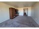Comfortable living area with neutral carpet and wall colors, and a well-equipped kitchenette in the background at 29 Montelago Blvd # 336, Henderson, NV 89011